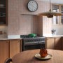 The Big Small House | Family kitchen with warm wood tones and Moroccan tiles | Interior Designers